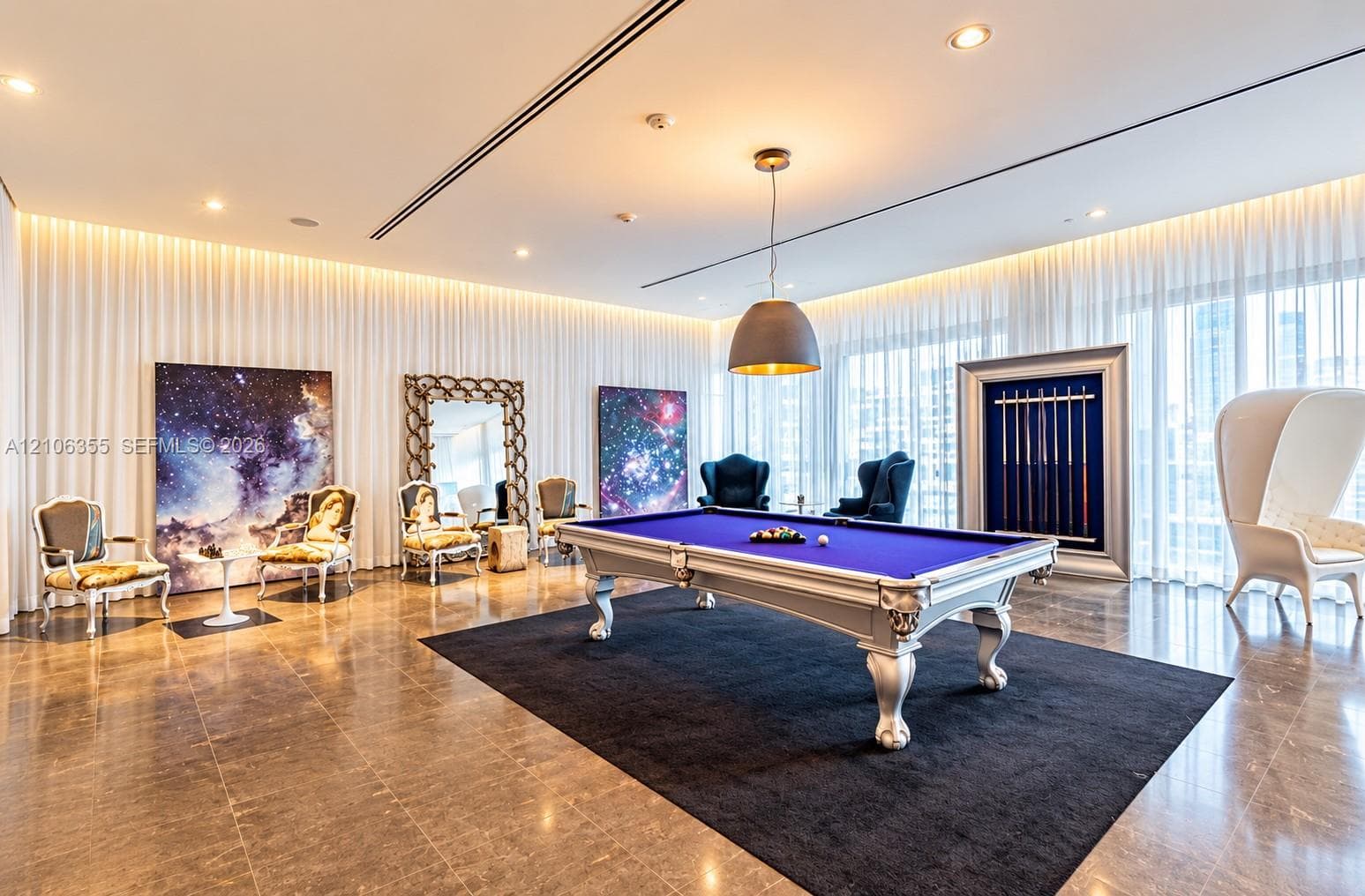 Large-format polished stone flooring, floor-to-ceiling sheer drapery, recessed lighting, and a large-scale pendant light fixture