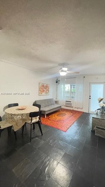 Large-format tile flooring, integrated ceiling fan, and wall-mounted climate control unit