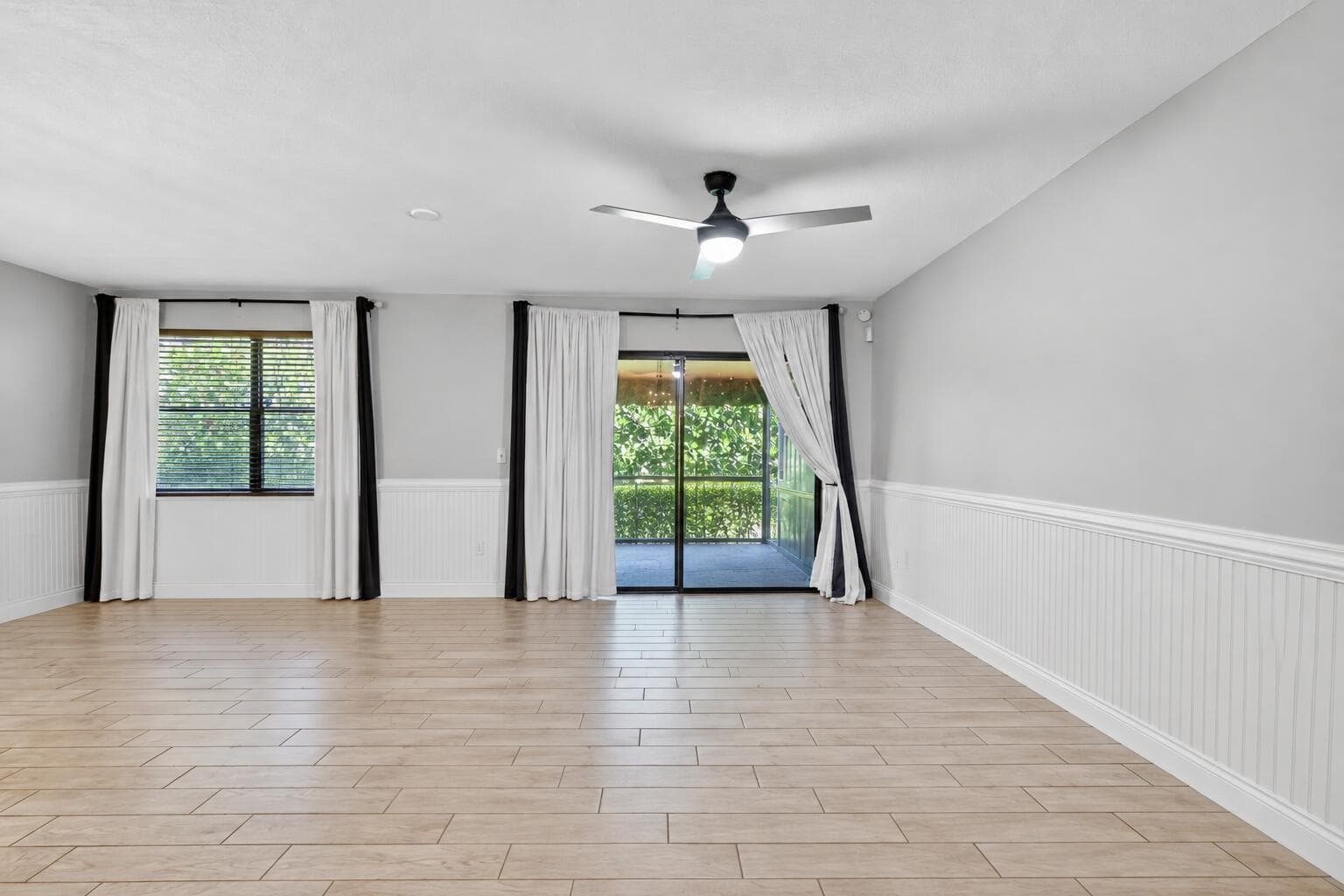 Empty living room with tiled floors-1