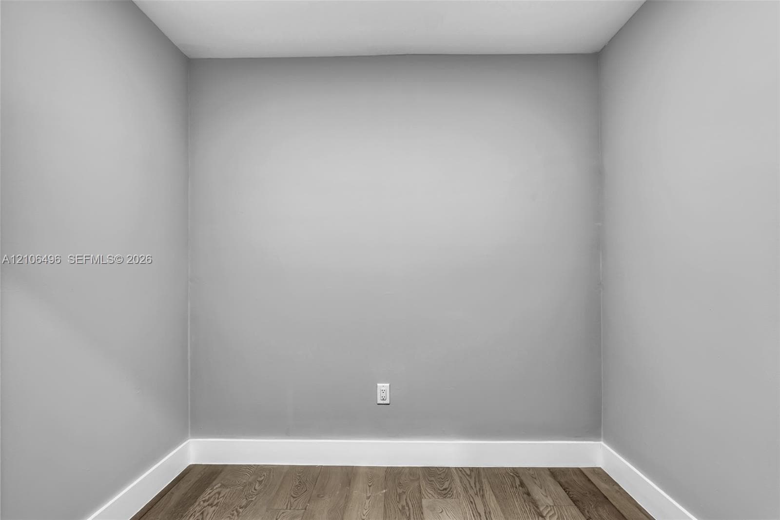 Neutral-toned walls and wood-finish flooring