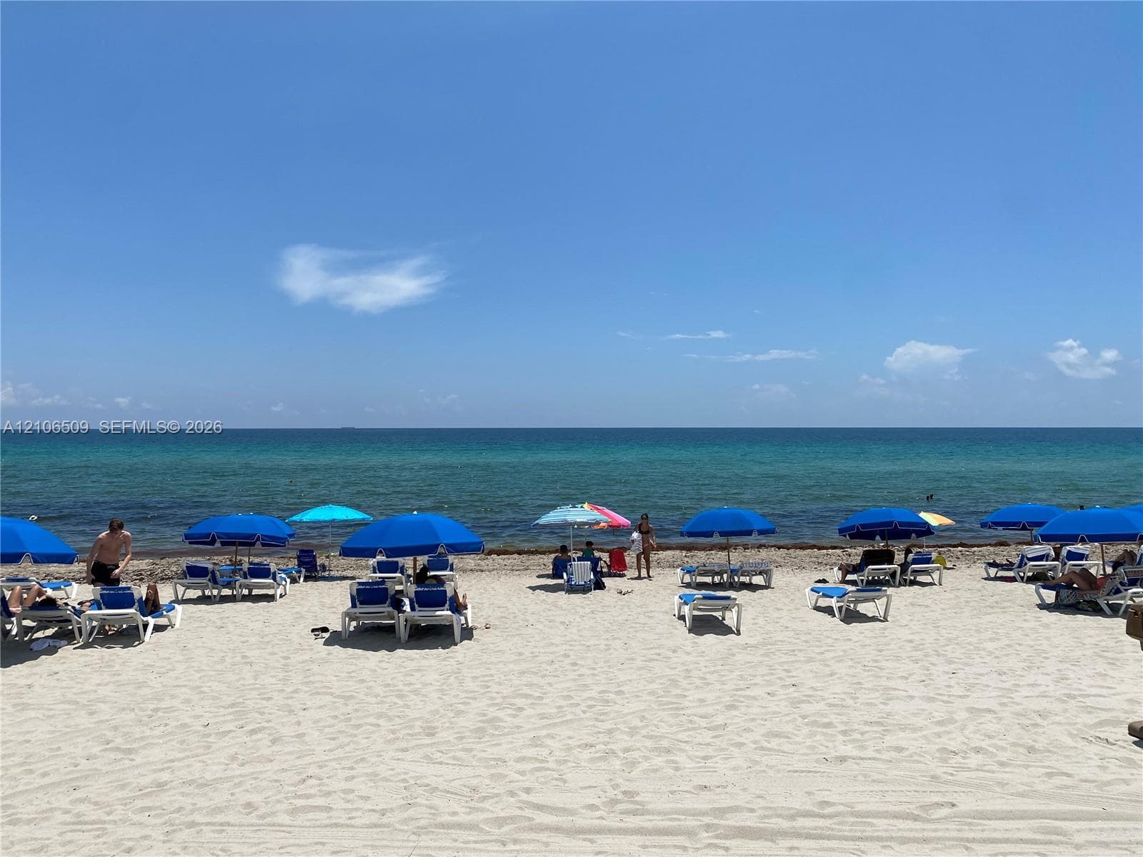 Sandy beachfront property featuring direct shoreline access and an open ocean horizon