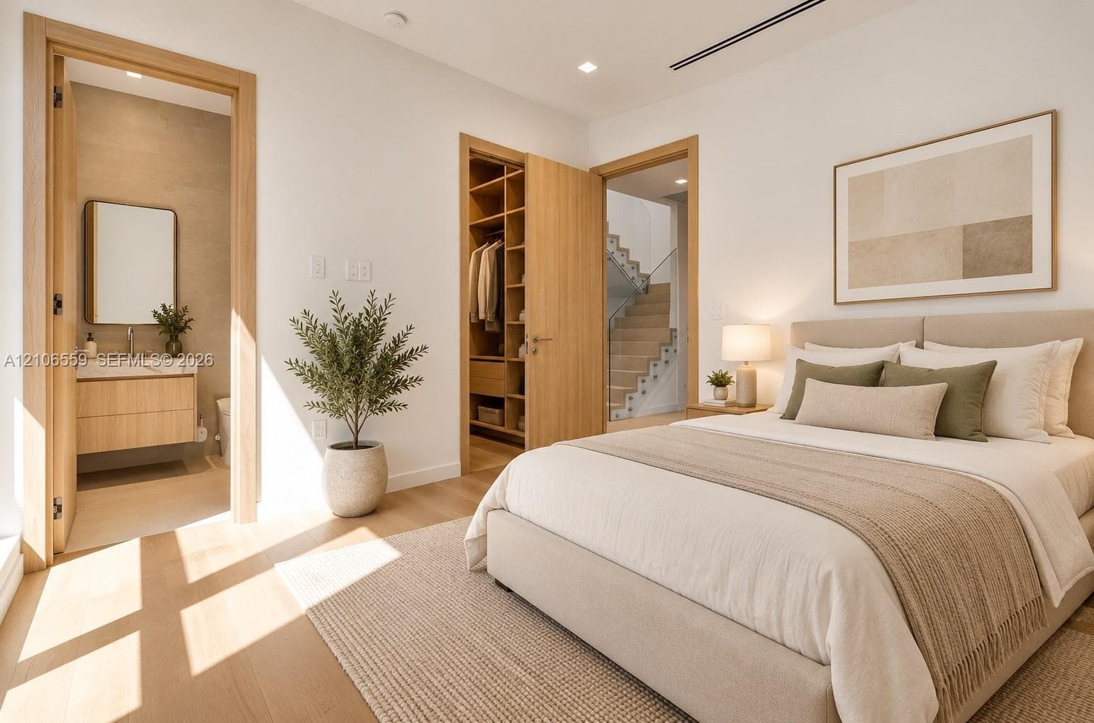 AI stage-Interior space featuring light wood-finish flooring, custom wood-veneer cabinetry, walk-in closet with built-in shelving, and recessed lighting