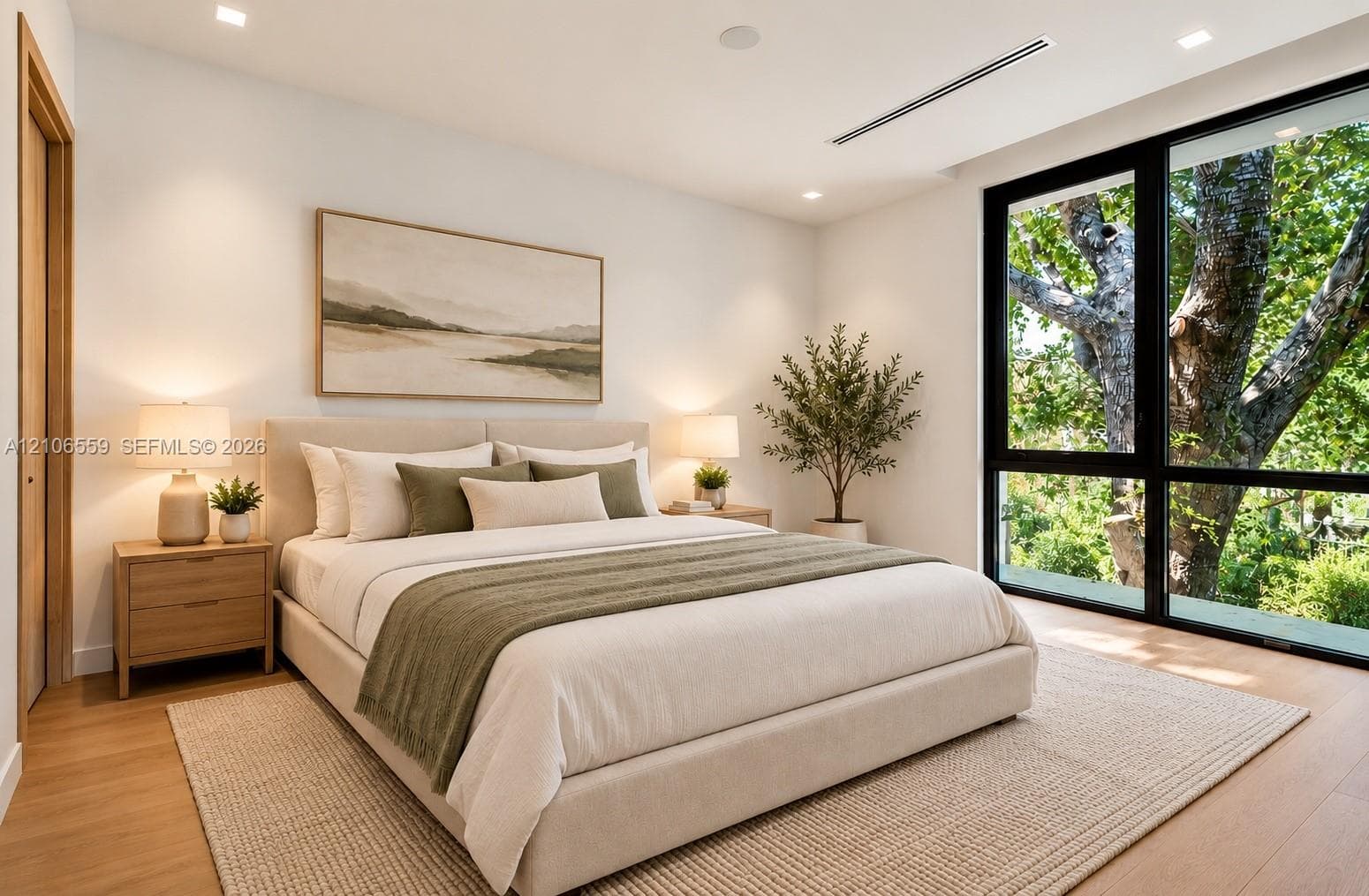 AI staged -Floor-to-ceiling black-framed windows, wood-finish flooring, recessed lighting, and linear HVAC diffuser