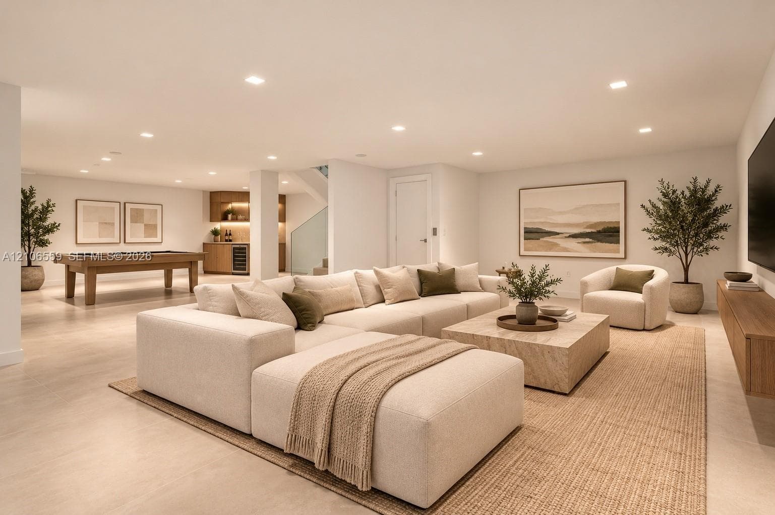 AI staged Open floor plan featuring recessed lighting, light-toned wood-finish flooring, a wet bar with built-in cabinetry, and a glass-paneled staircase