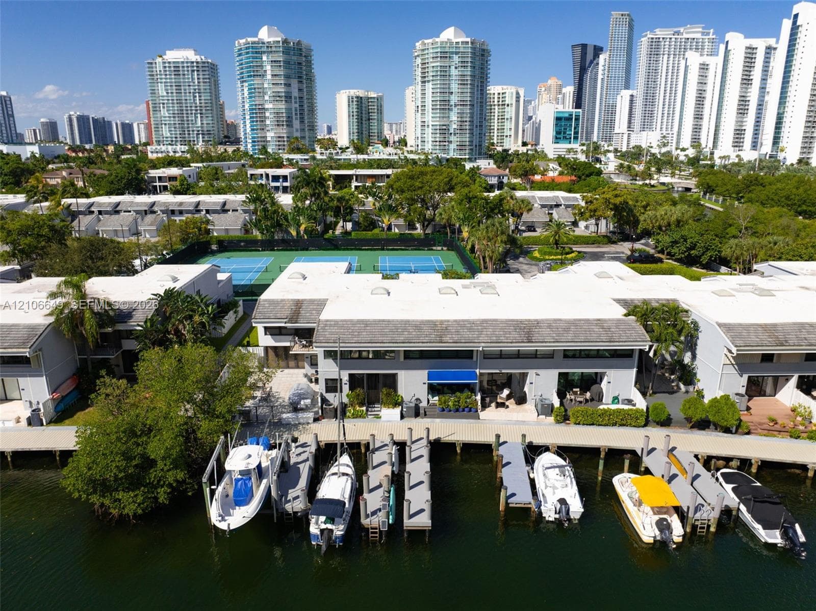 Waterfront residential community featuring three hard-surface tennis courts and immediate canal access