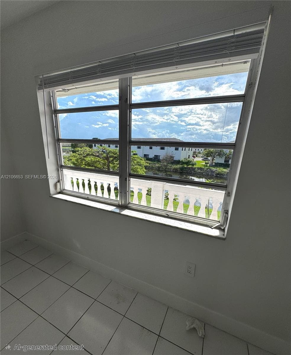 Horizontal sliding window with metal framing, white ceramic tile flooring, and integrated white balustrade