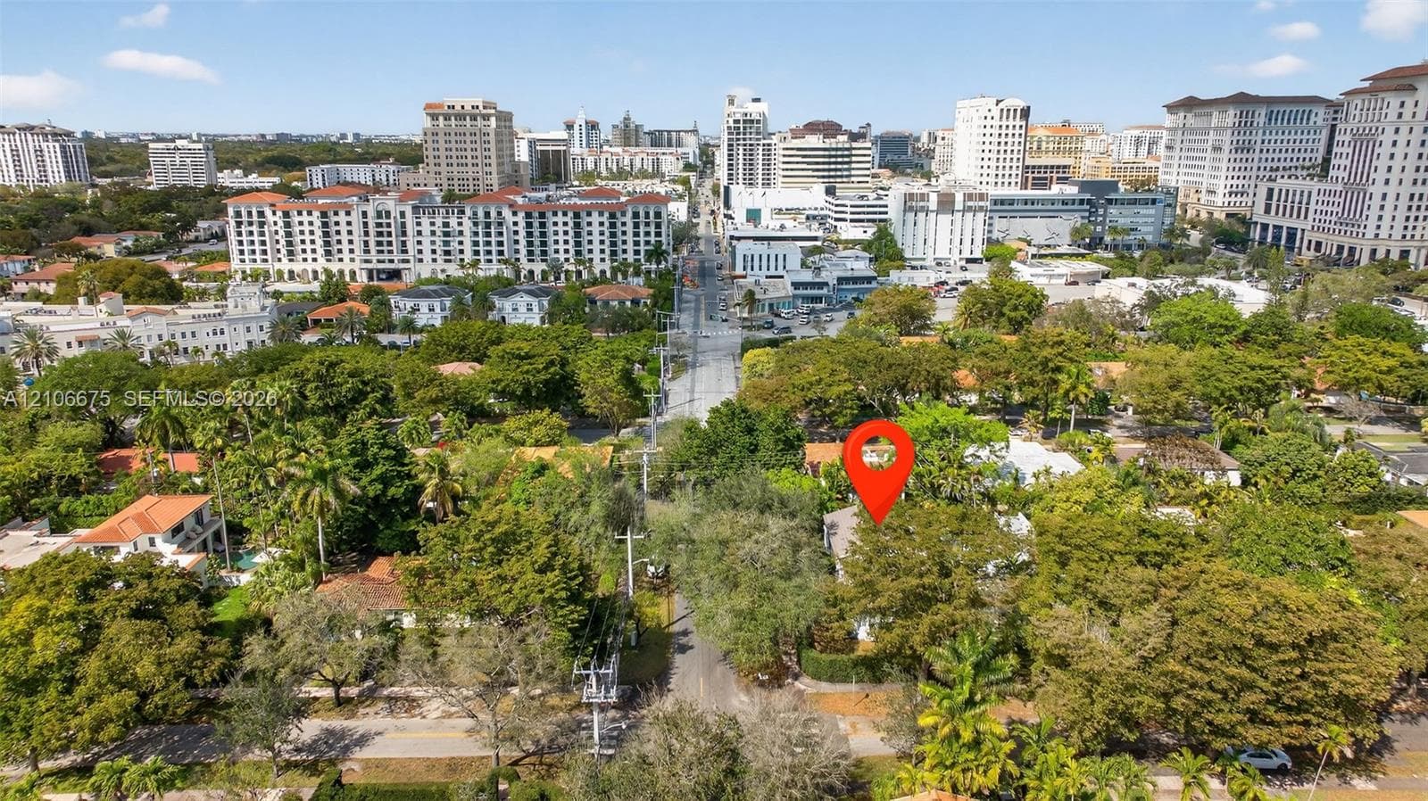 Aerial perspective highlighting the property location within a dense canopy of mature trees and urban infrastructure