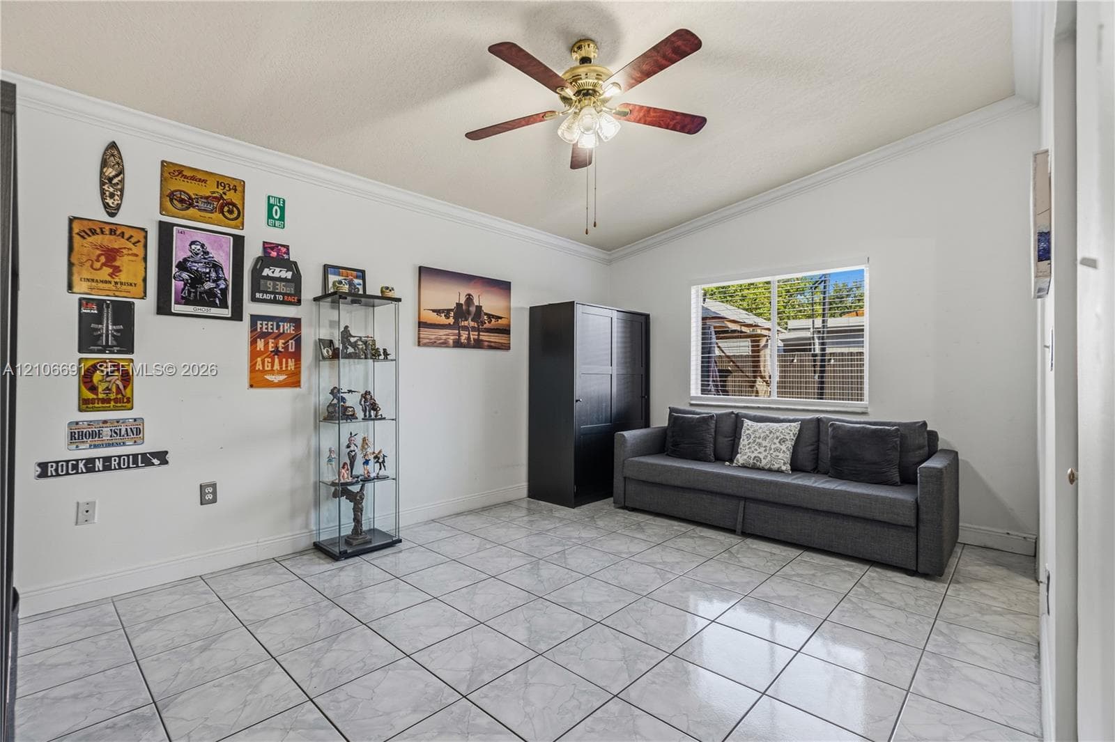 Spacious living area featuring tile flooring, recessed lighting, and a ceiling fan with integrated light fixture