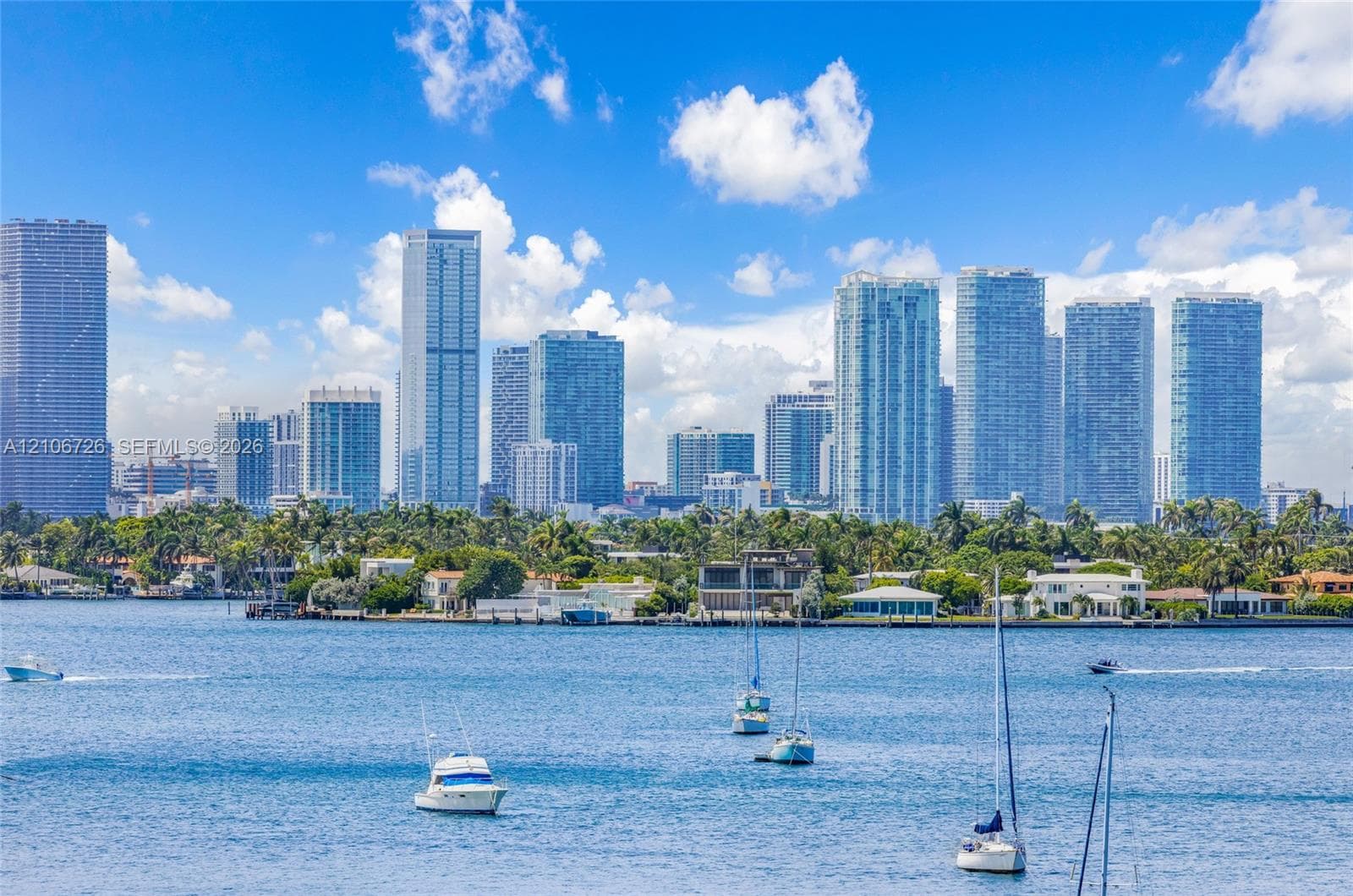 Waterfront setting featuring a deep-water bay and direct proximity to a metropolitan skyline