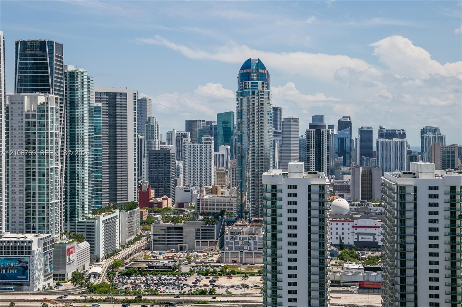 High-rise urban landscape featuring diverse skyscraper architecture, glass-paneled facades, and dense metropolitan density