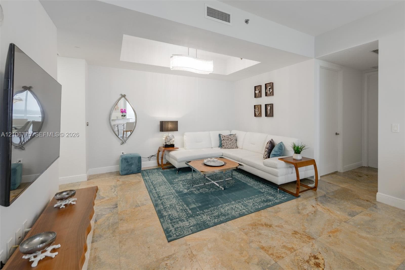 Polished stone flooring, recessed ceiling tray, and integrated light fixture
