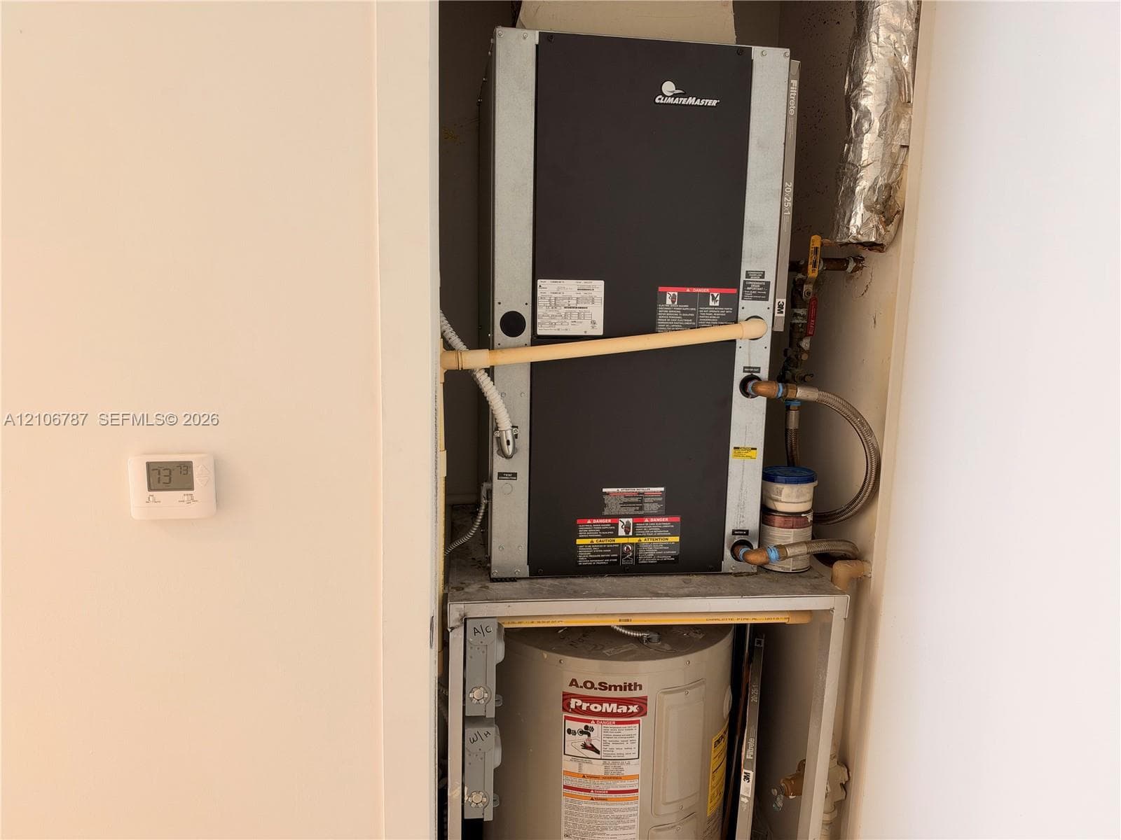 ClimateMaster vertical water-source heat pump unit paired with an A.O