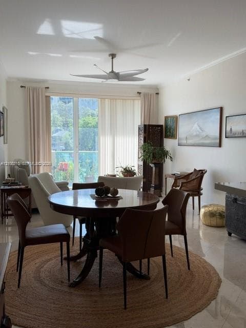 Open interior space featuring polished stone flooring, a breakfast bar, and a modern ceiling fan