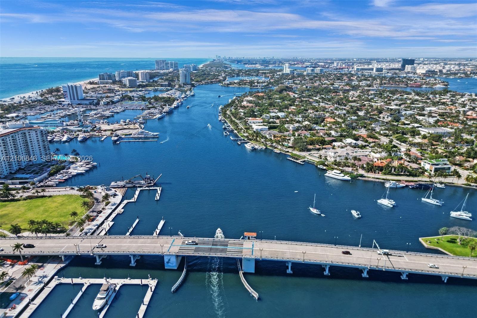 Aerial perspective of a coastal waterway featuring marina docking facilities, deep-water access, and extensive waterfront shoreline