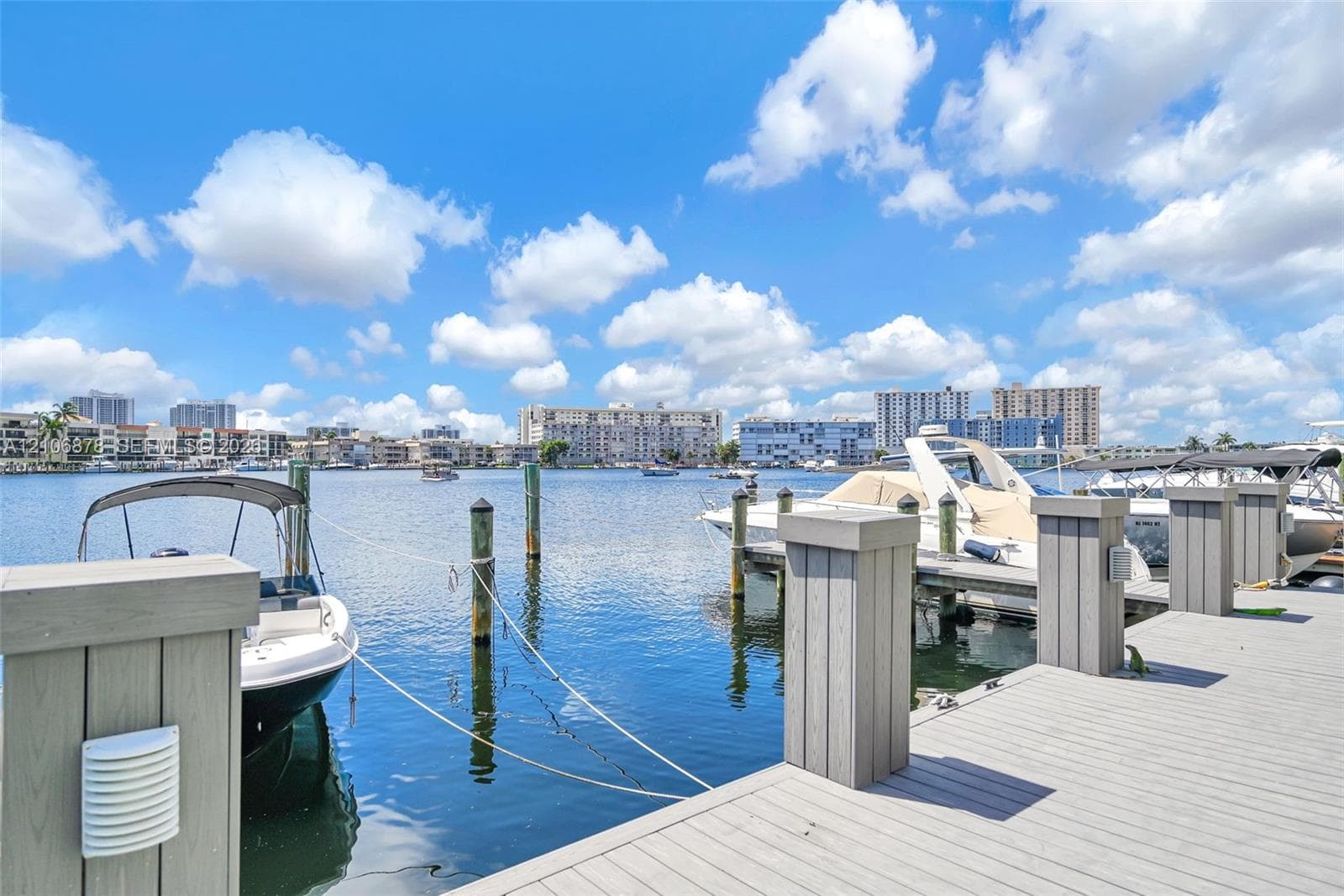 Private deep-water dock featuring composite decking, vertical pilings, and integrated low-voltage lighting