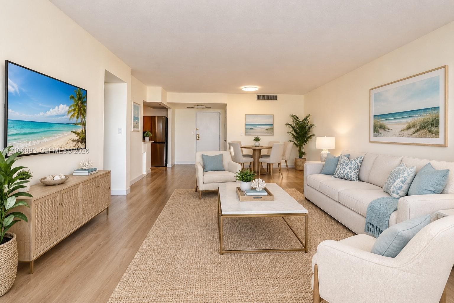 Open-concept living space featuring wood-finish flooring and recessed ceiling lighting