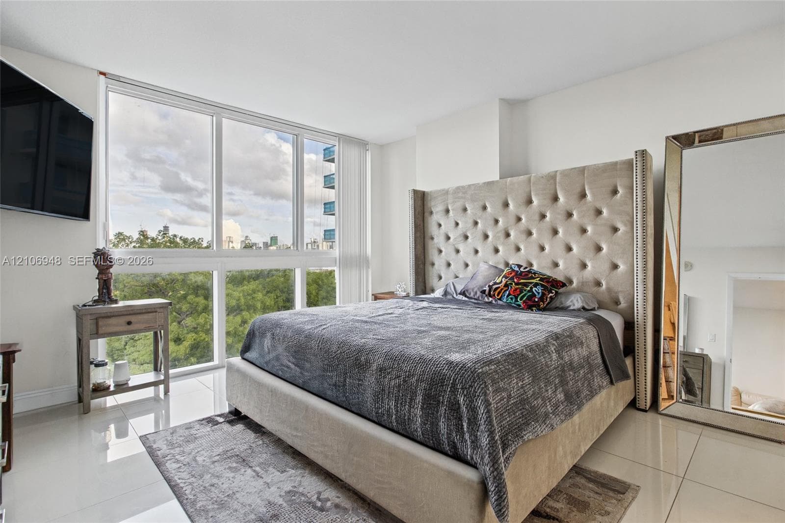 Granite-finish countertop, recessed lighting, and built-in stacked laundry appliances