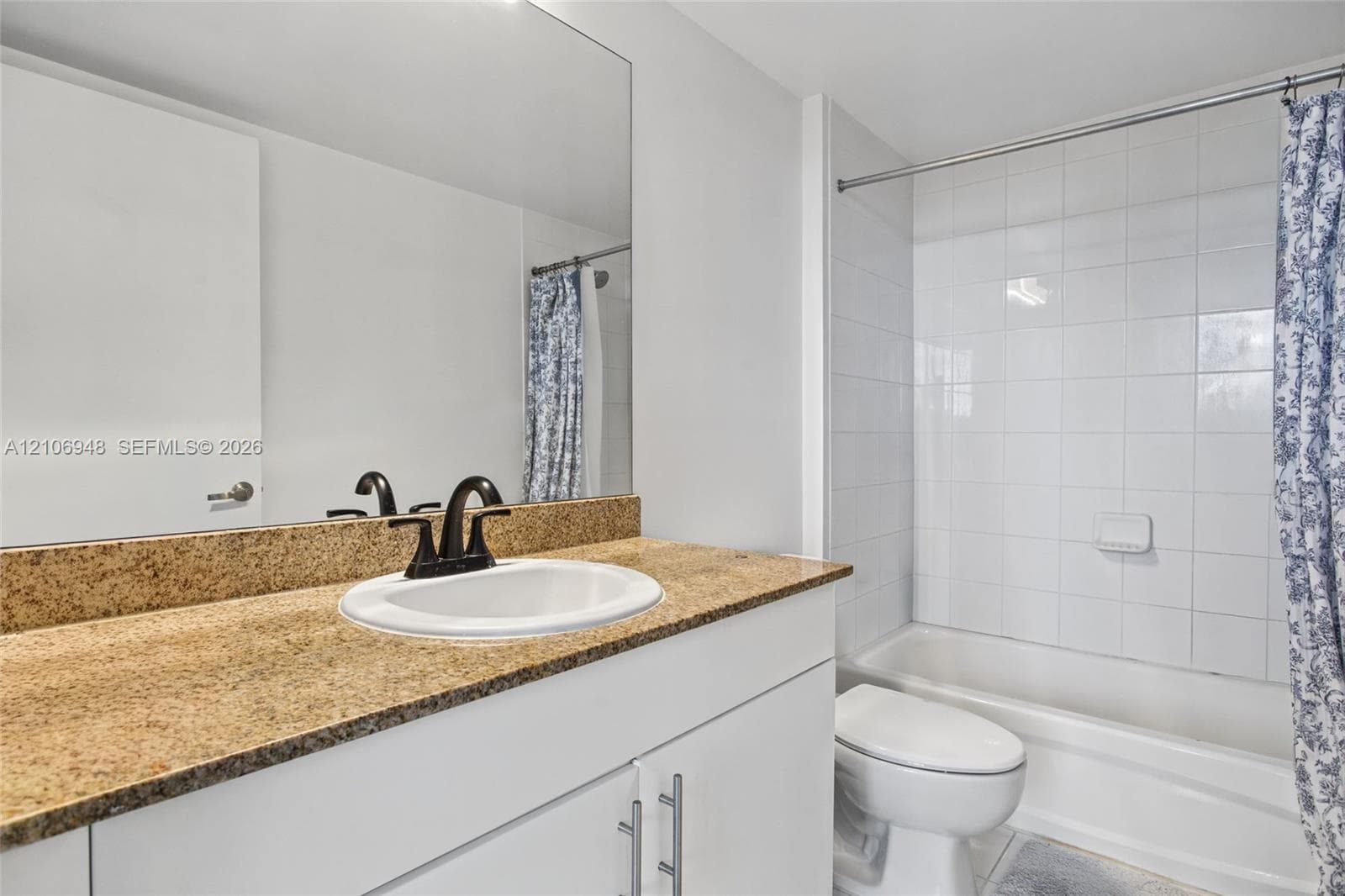 Floor-to-ceiling windows featuring expansive exterior scenery and polished tile flooring