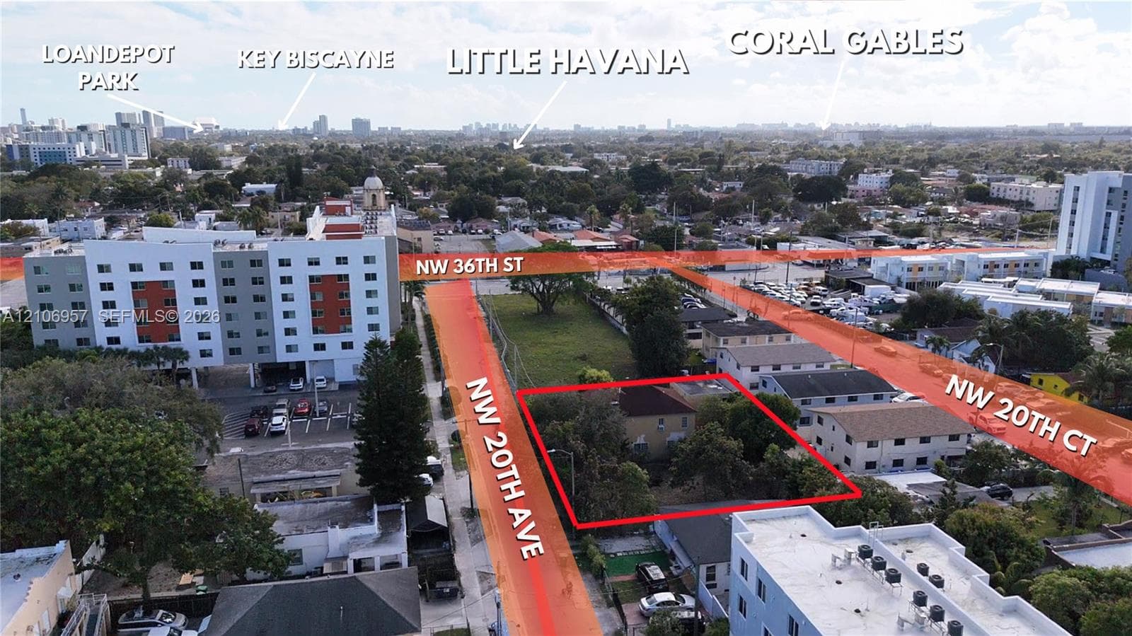 Aerial perspective of a corner lot property situated at the intersection of NW 20th Avenue and NW 20th Court, featuring mature trees and established perimeter landscaping