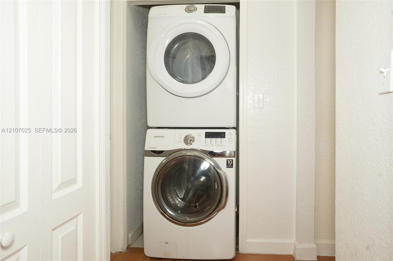 Stacked white front-load washer and dryer set