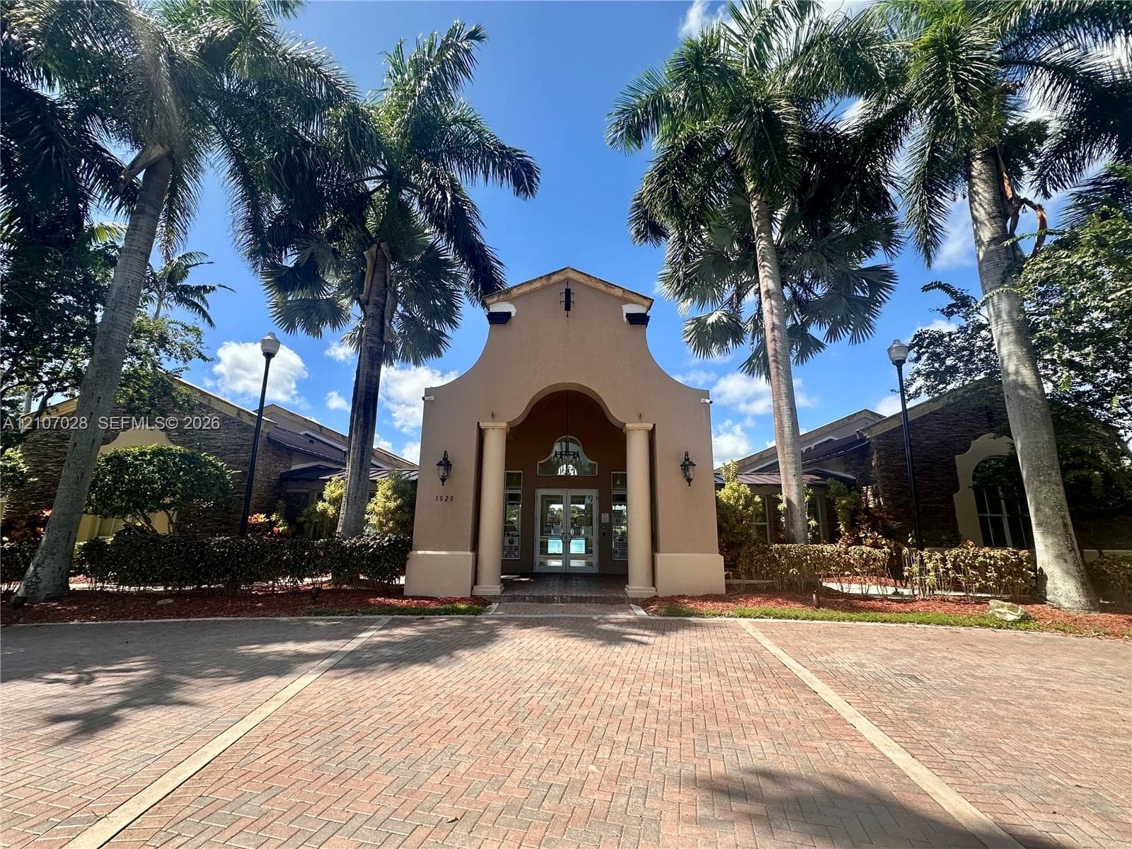 Club House, mature palm trees