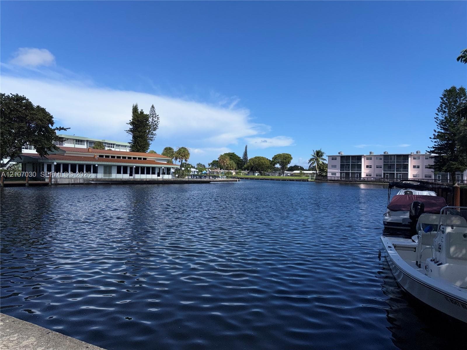 Waterfront locale featuring a concrete seawall, deep-water access, and space for boat docking