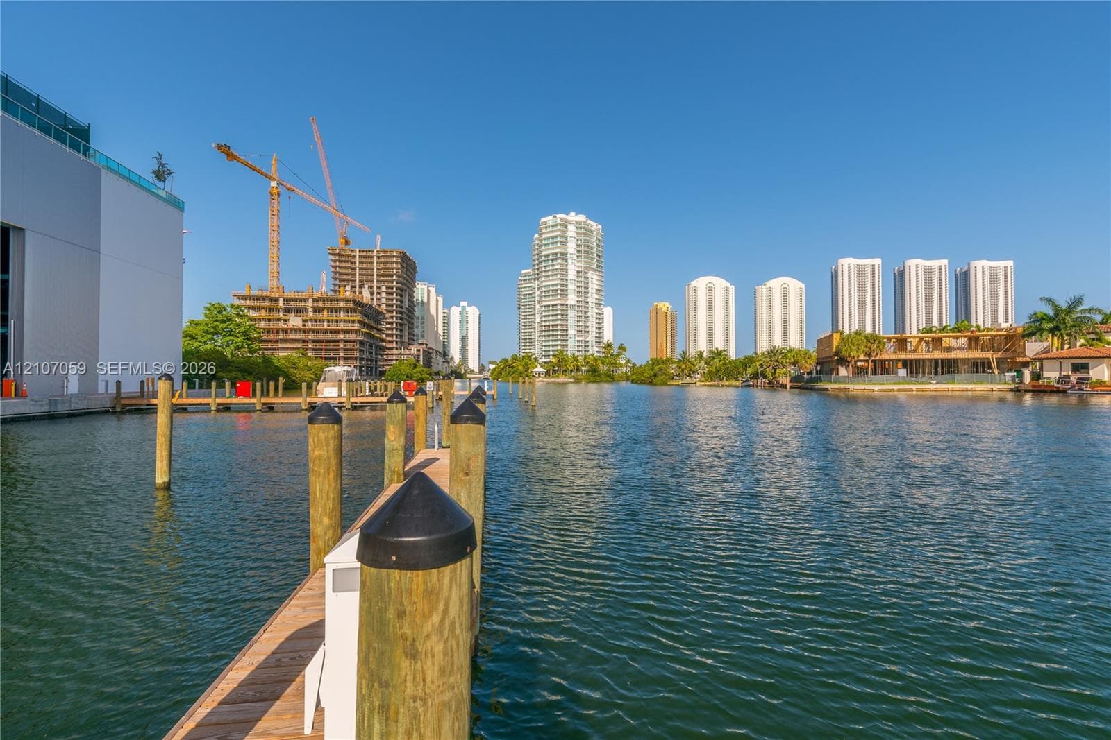 Deep-water dockage featuring wooden pilings and a direct waterway bulkhead