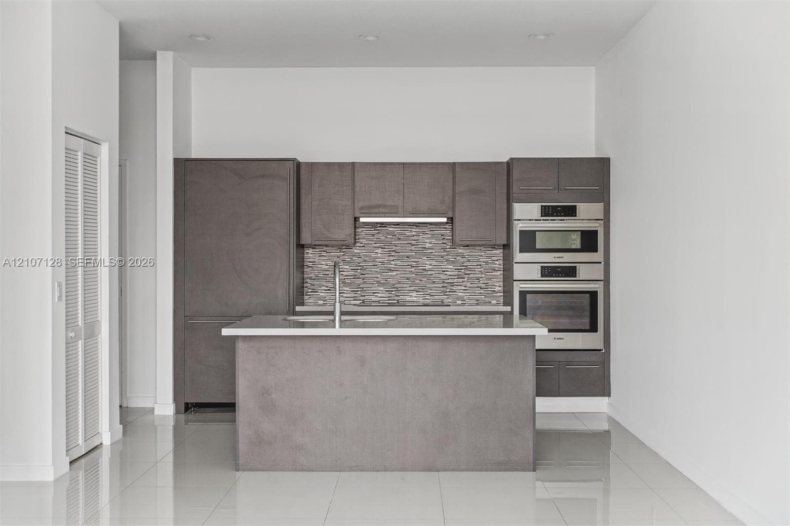 Modern kitchen viewed from the living area.
