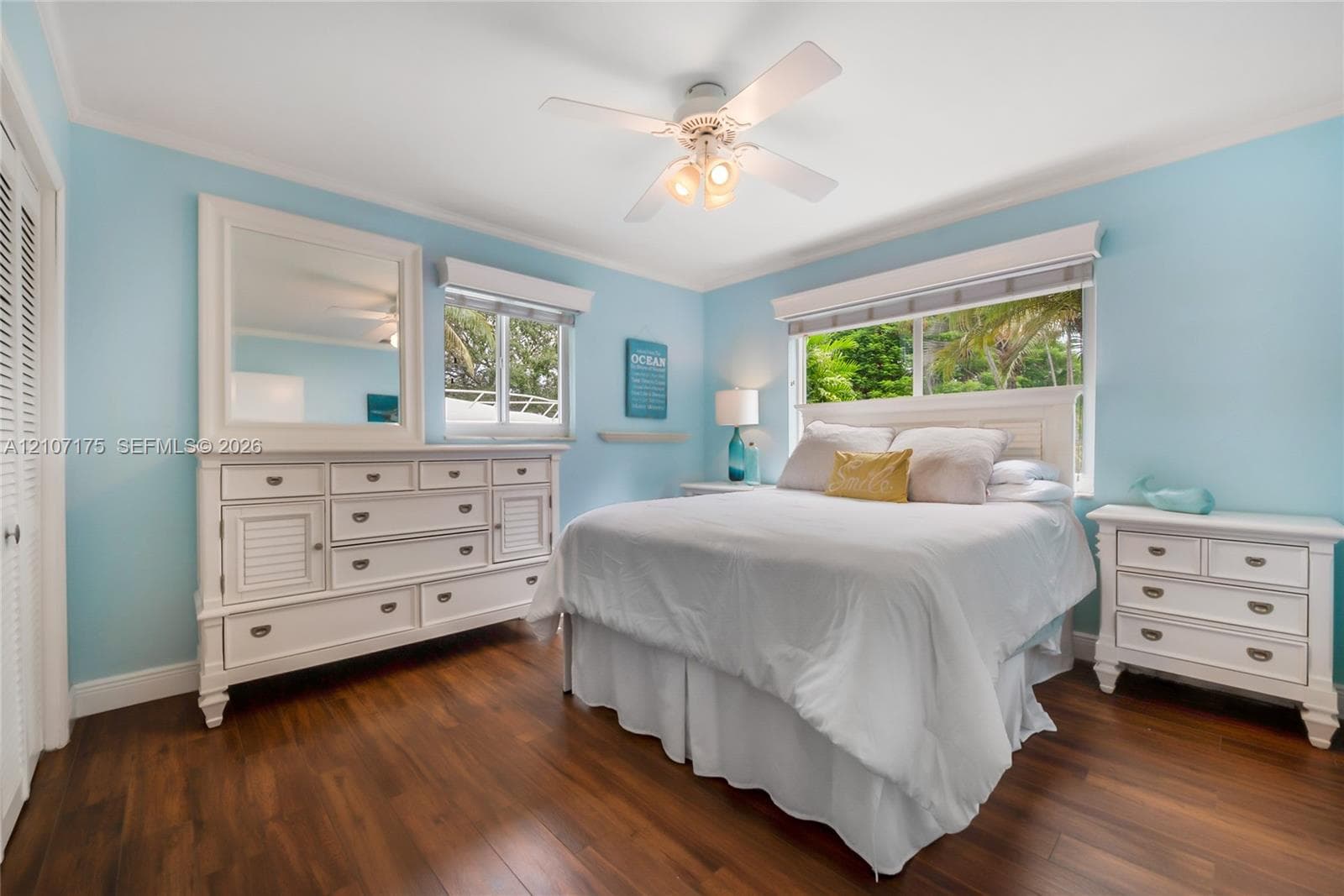 Spacious 3rd bedroom has blinds and sliding impact windows.