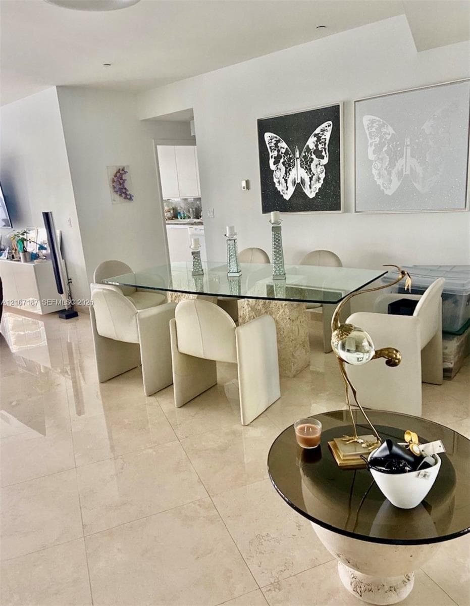 Polished stone flooring throughout and recessed ceiling lighting