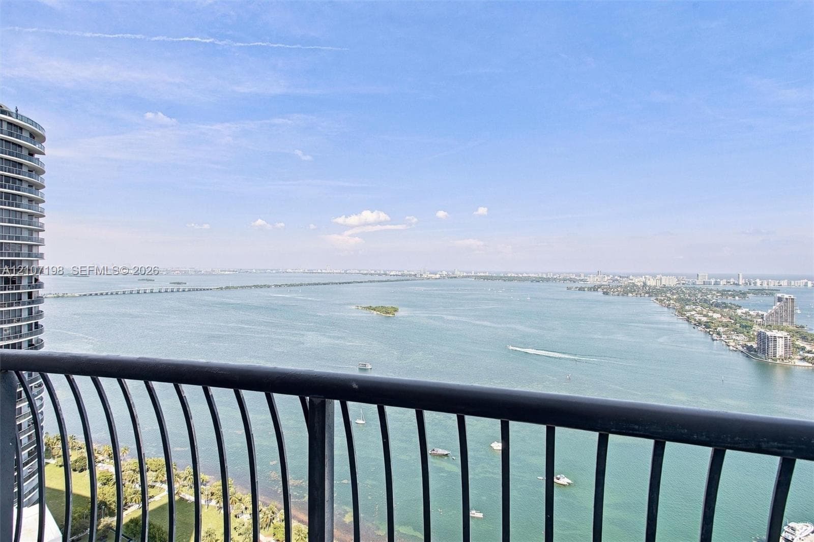 Panoramic urban skyline featuring expansive waterfront exposure, a deep-water marina, and extensive bridge infrastructure