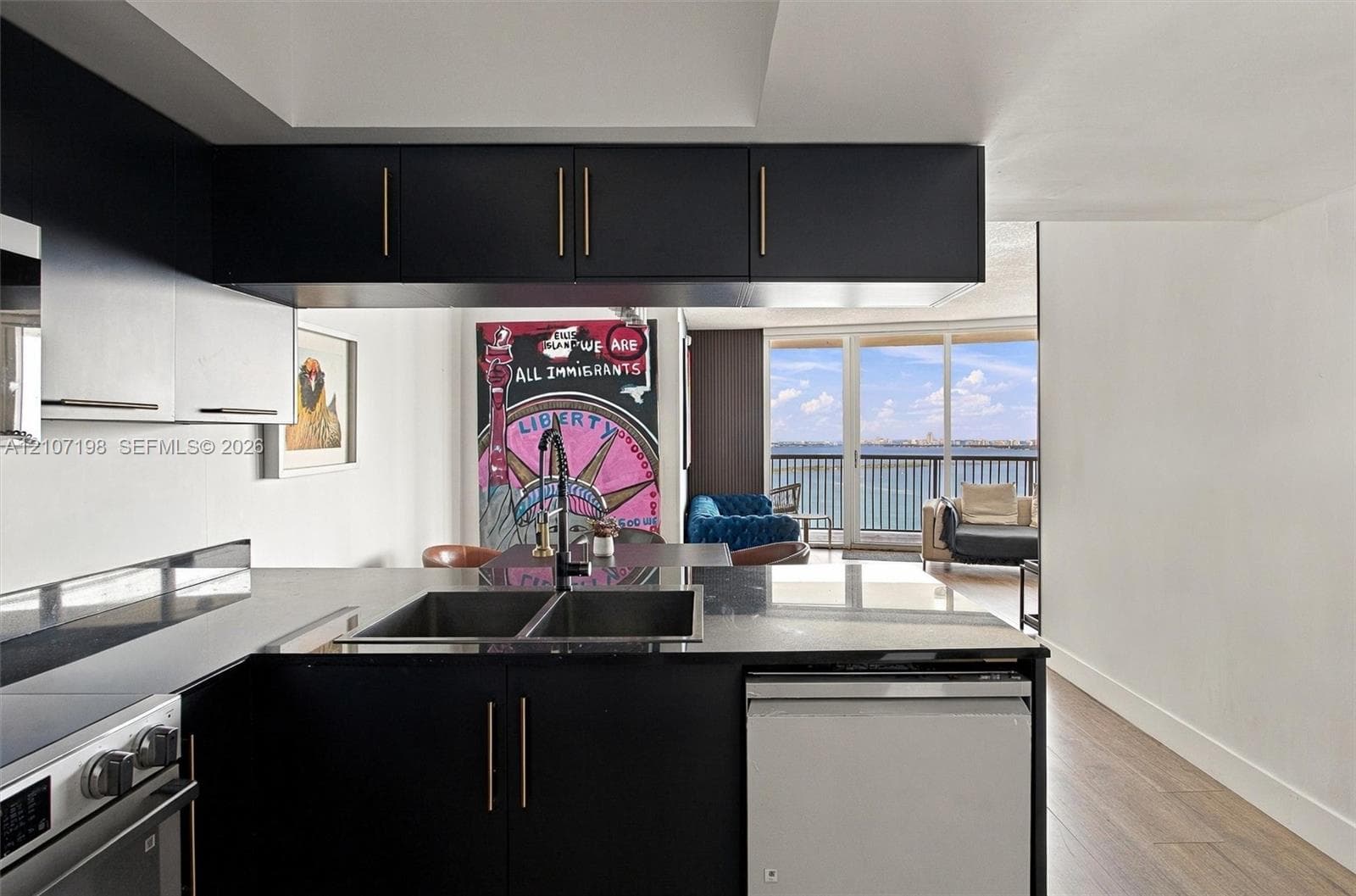 High-rise perspective featuring expansive water panoramas, coastal horizon, and a protected marina with deep-water boat slips