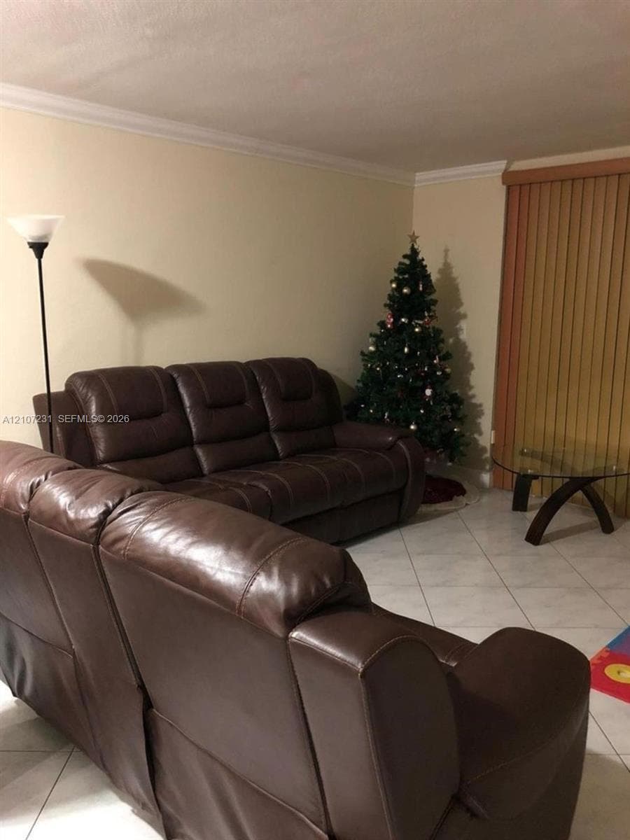 Tile flooring, crown molding, and vertical blinds
