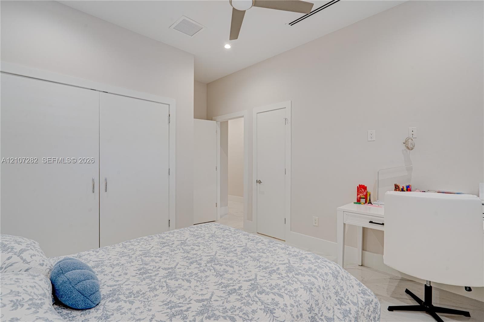Neutral-toned room featuring a ceiling fan with integrated lighting, recessed lighting, and a double-door closet