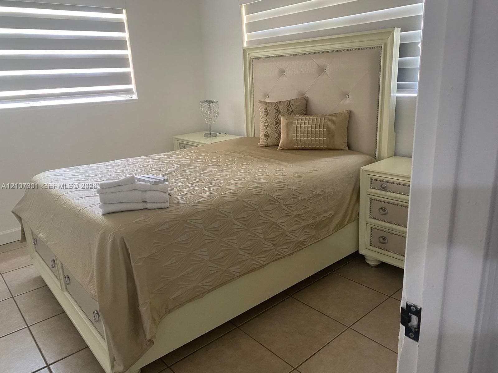 Ceramic tile flooring and dual-layer window treatments