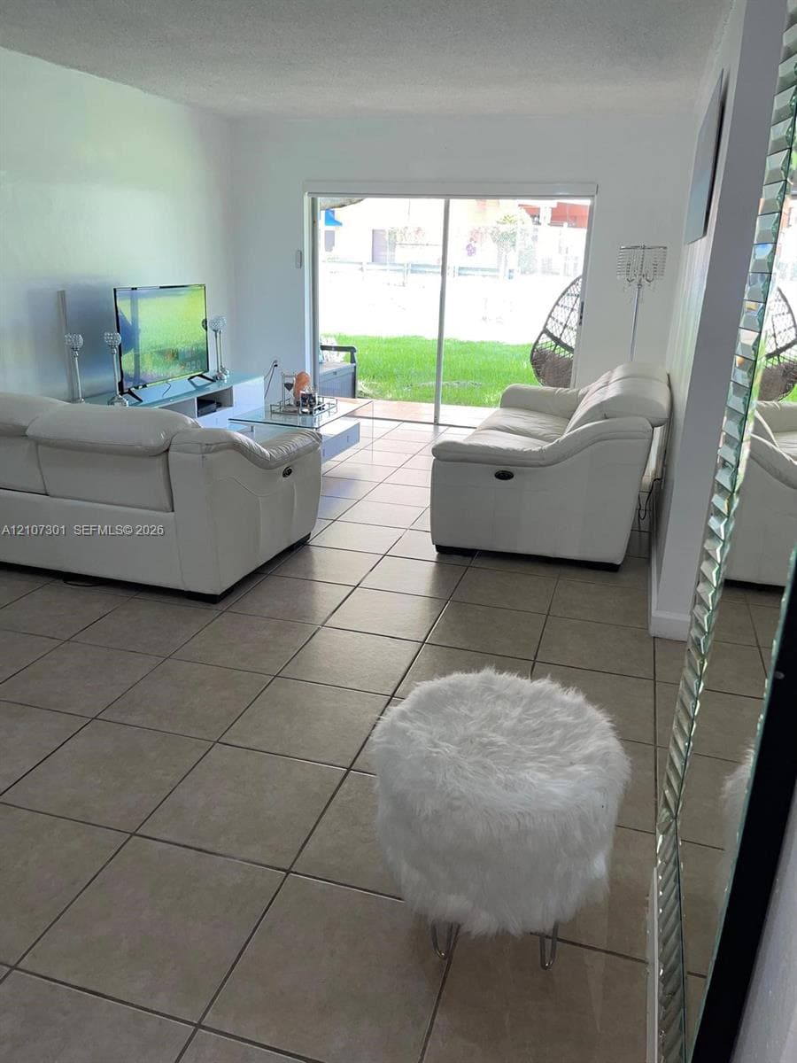 Ceramic tile flooring, sliding glass door, and interior wall finishes