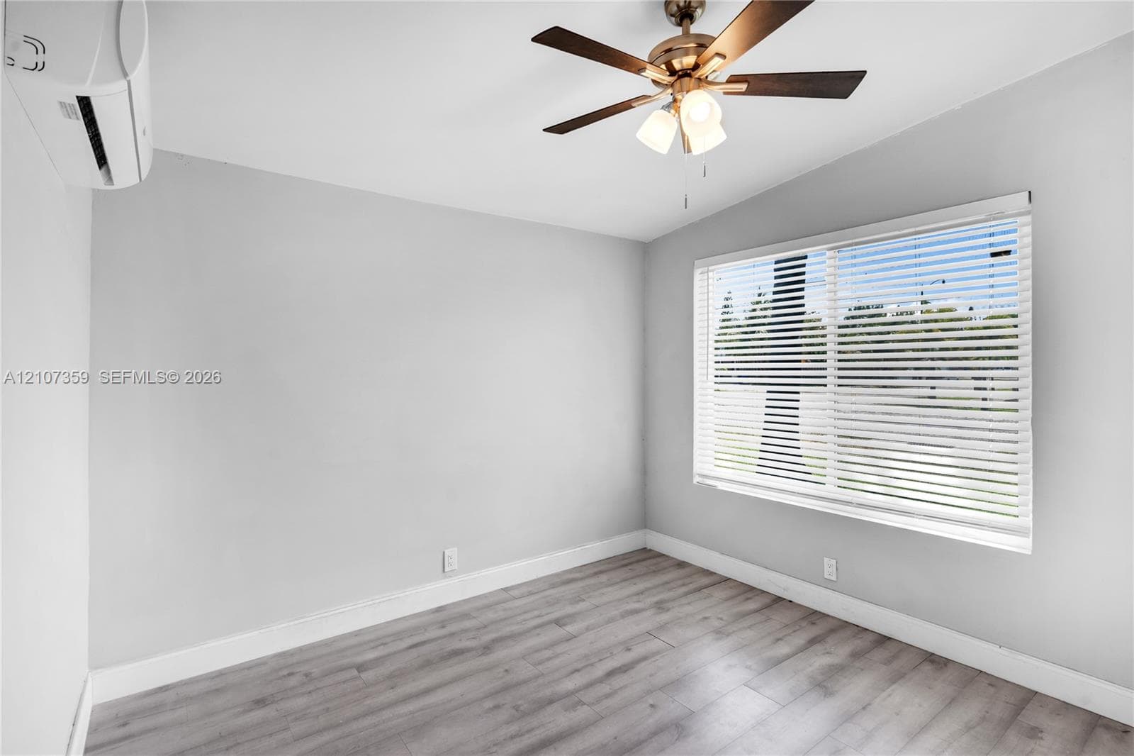 Additional bedroom view highlighting the room’s natural light and neutral finishes.