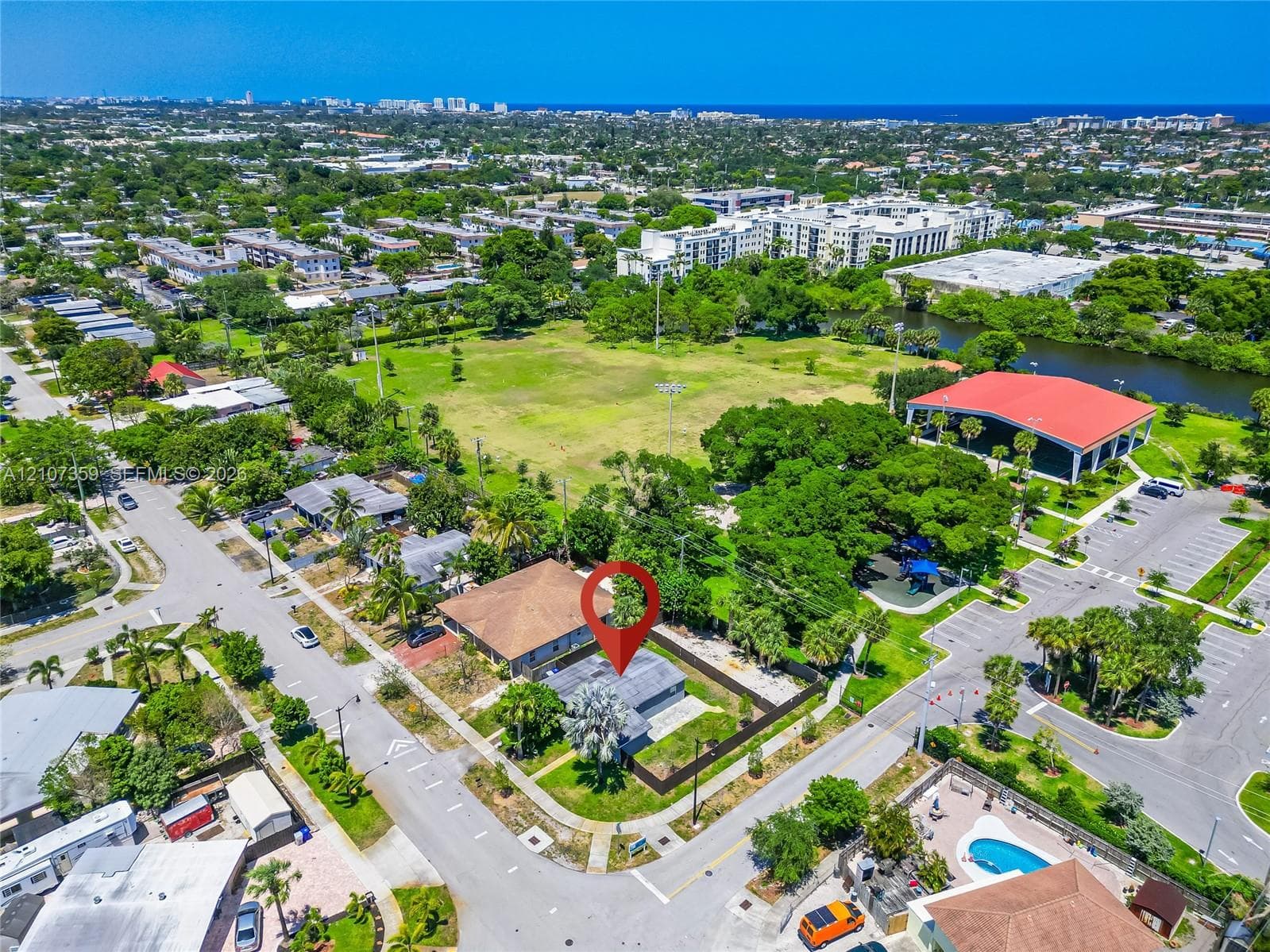 Aerial view showing the property’s location and proximity to nearby green space.