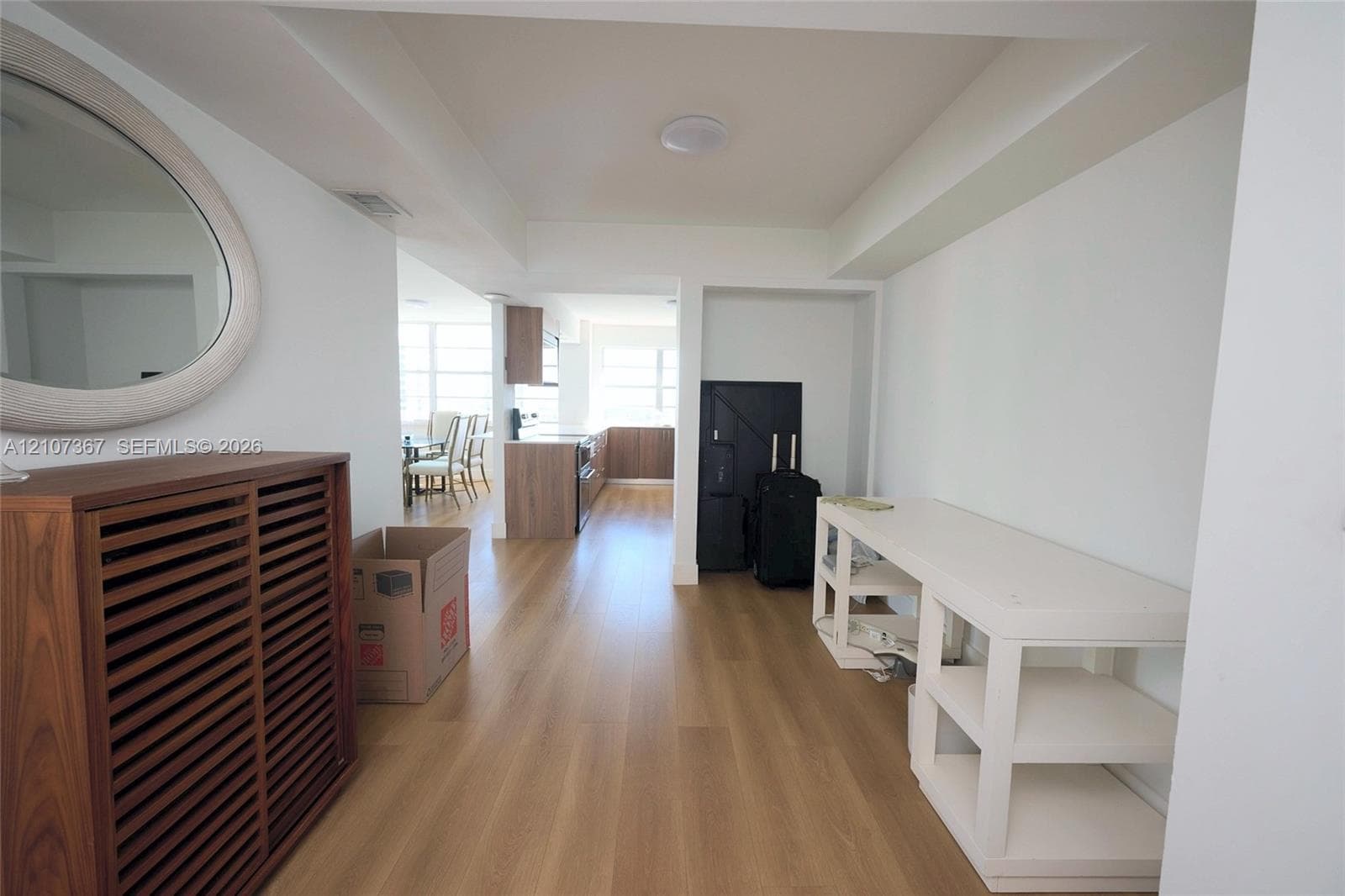 Neutral-toned wall finish with wood-finish flooring