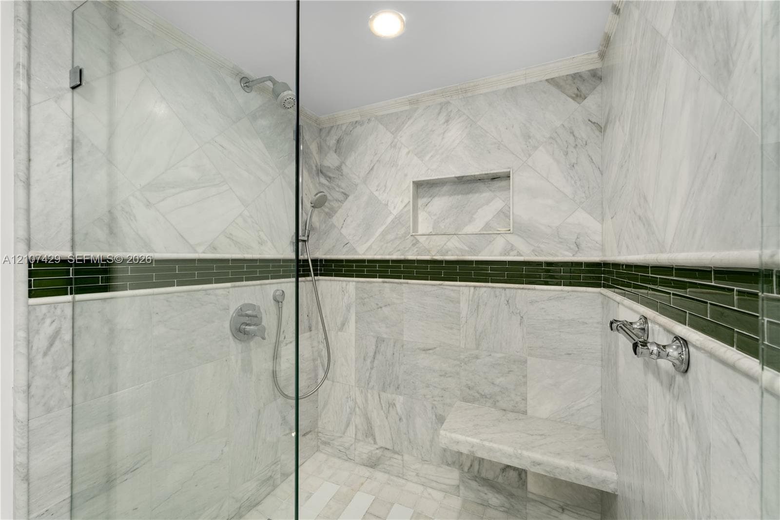 Bathroom featuring dual vessel sinks, stone-patterned vanity countertop, full-height wall mirrors, and recessed ceiling lighting
