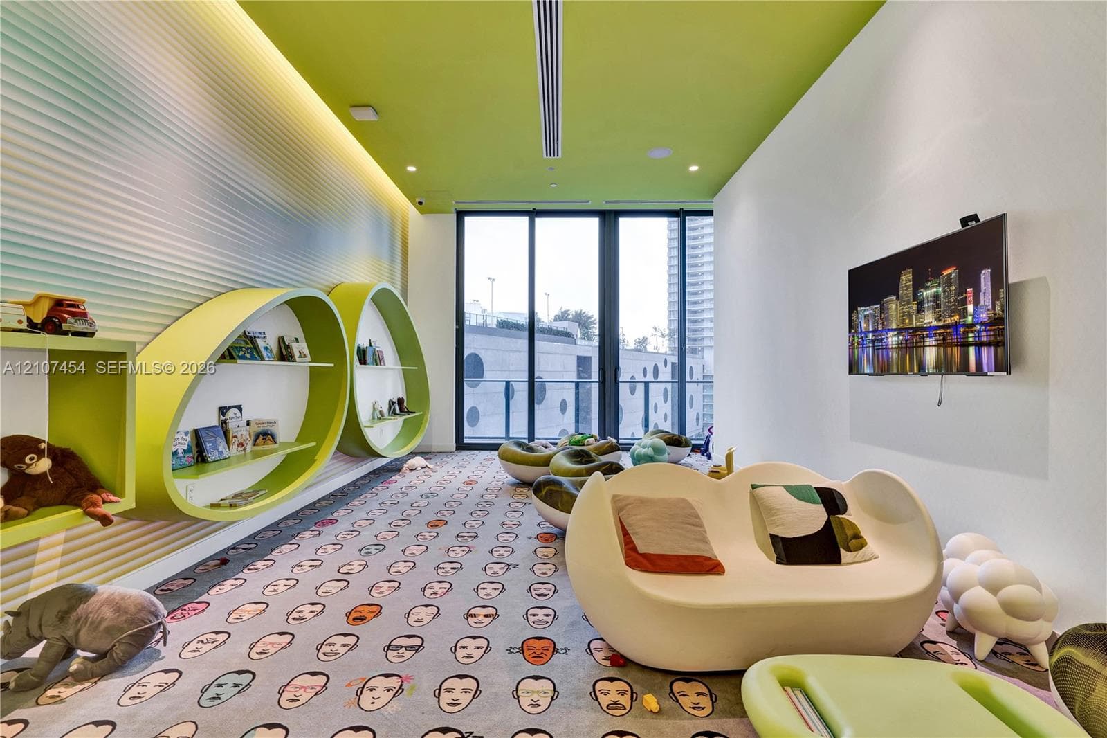 Custom interior featuring textured, wave-pattern wall paneling, built-in elliptical shelving, a linear recessed ceiling fixture, and floor-to-ceiling glass sliding doors