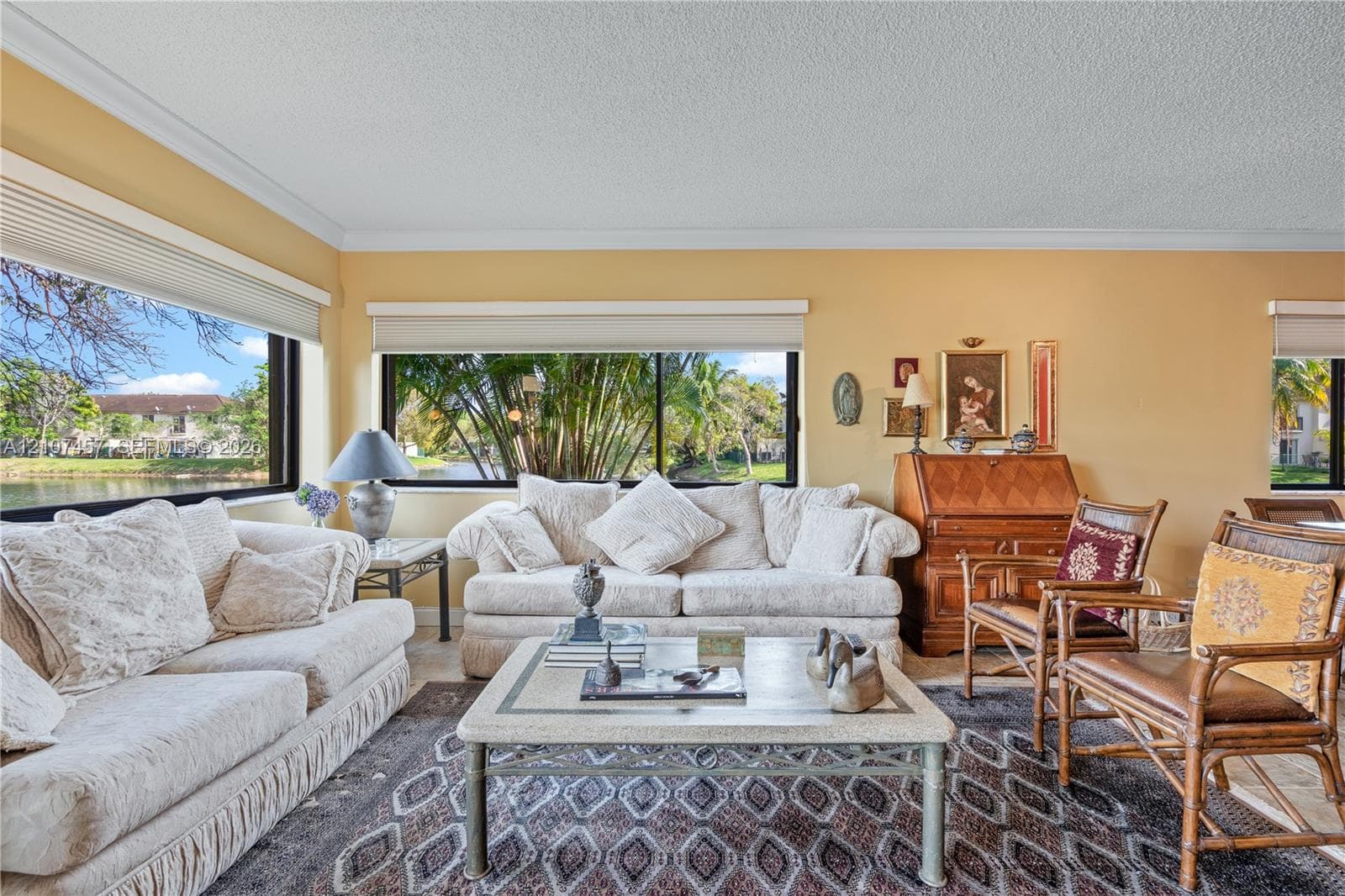 Living area featuring expansive windows, natural light, and tile flooring