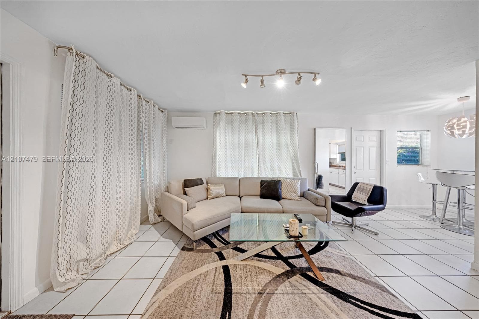 Tiled flooring and large-scale spherical pendant lighting