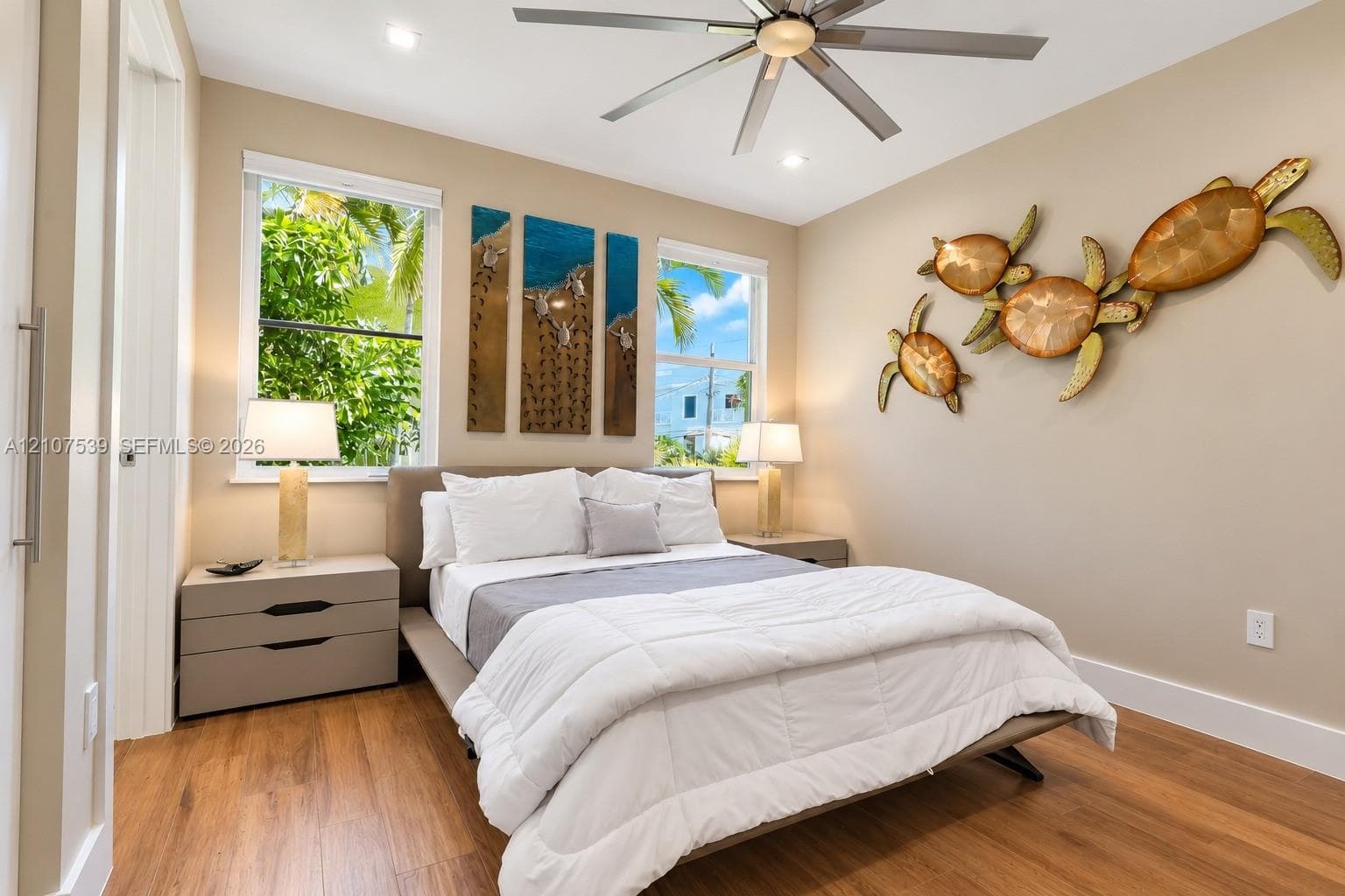 Bedroom featuring wood-finish flooring, recessed lighting, and a multi-blade ceiling fan