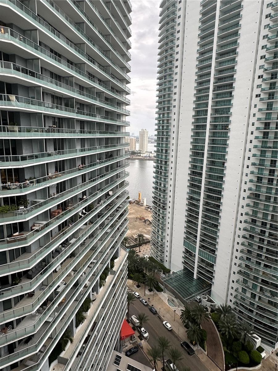 High-rise architecture featuring wrap-around glass railings and expansive private balconies