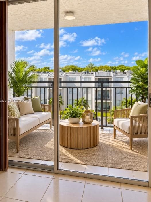 Covered balcony with a metal railing and tile flooring