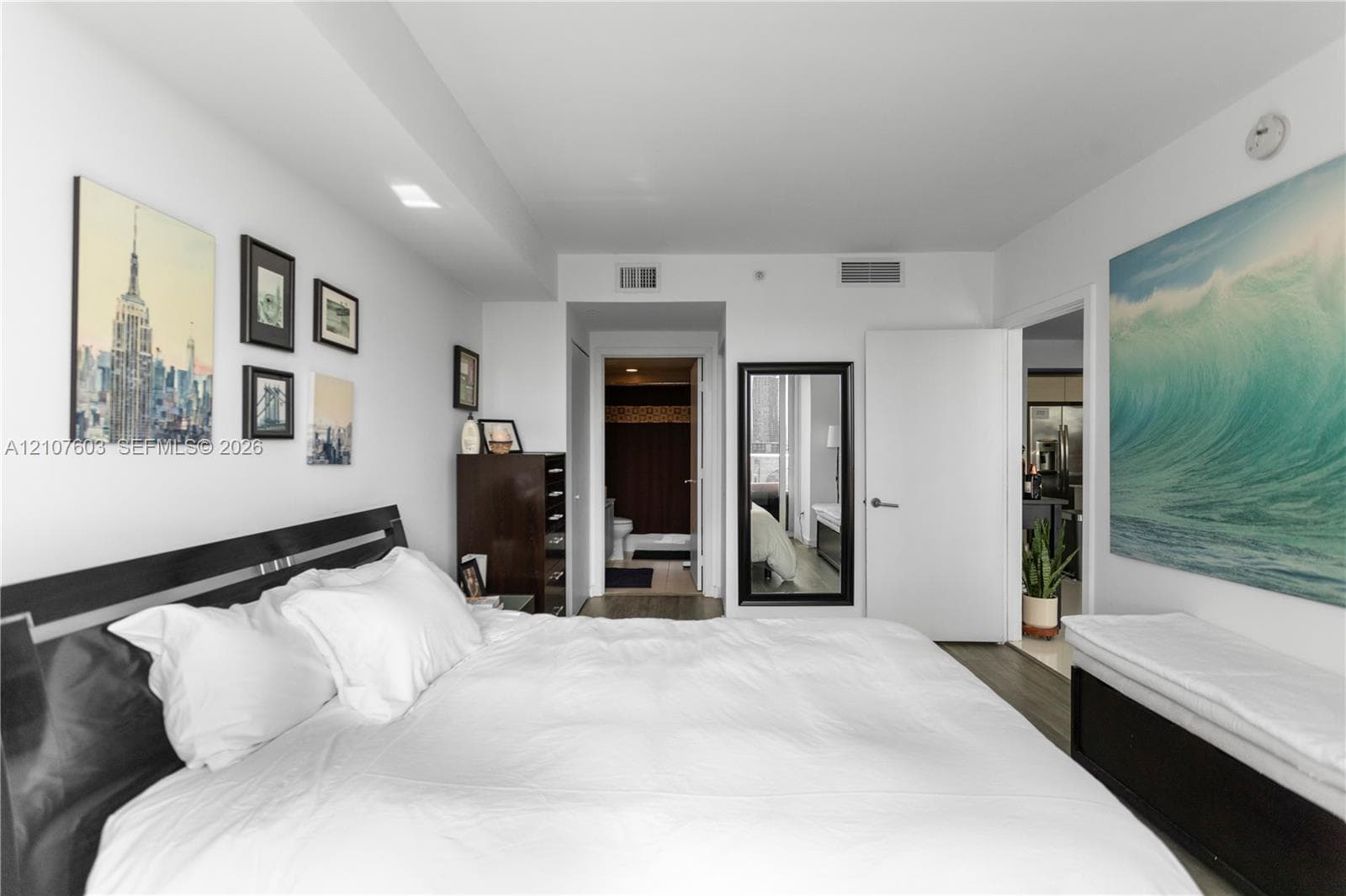 Room featuring neutral wall finishes, recessed lighting, and wood-finish flooring