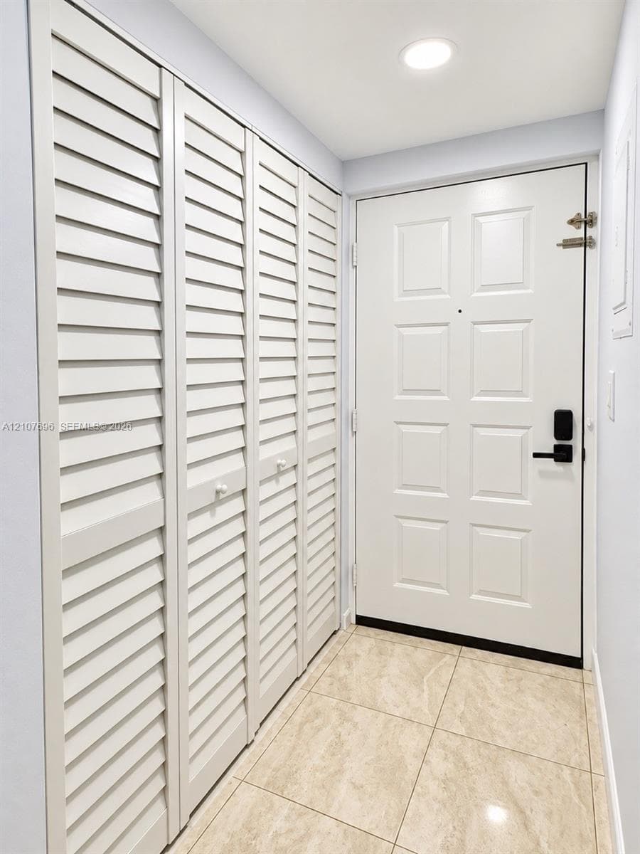 Storage space featuring wood-finish flooring and tiered wire shelving