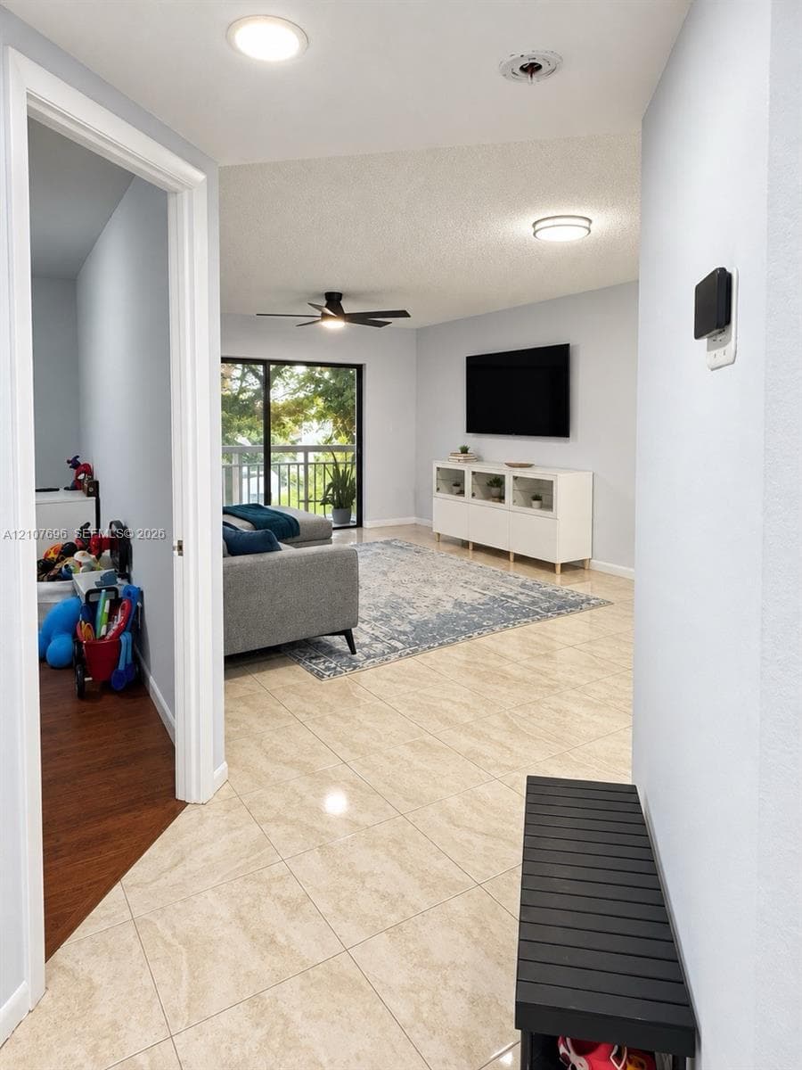 Laundry area featuring white front-load appliances and wall-mounted wire shelving