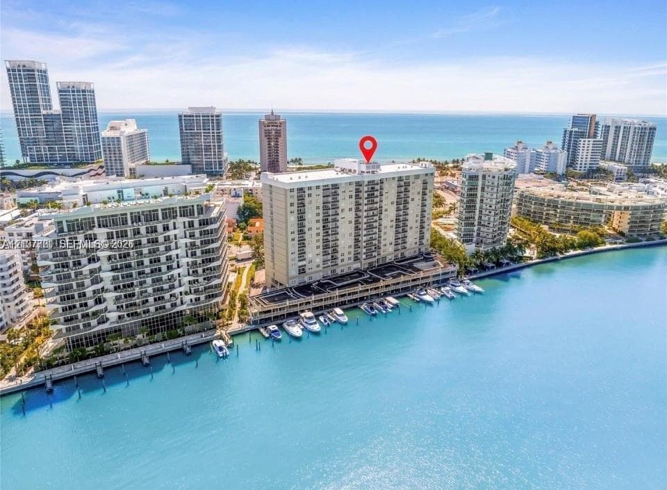 Waterfront mid-rise building featuring private deep-water boat slips and direct access to open water